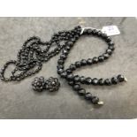 19th cent. Black glass jewellery, necklaces one with matching earrings. 18ins. and 40ins.