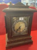 Early 20th cent. Oak cased 8 day bracket clock, brass spandrels and silver Roman numerals dial.