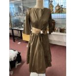 Ismay Collection: Mid 20th cent. Fashion: Silk taffeta coffee colour mid length cocktail dress, slit