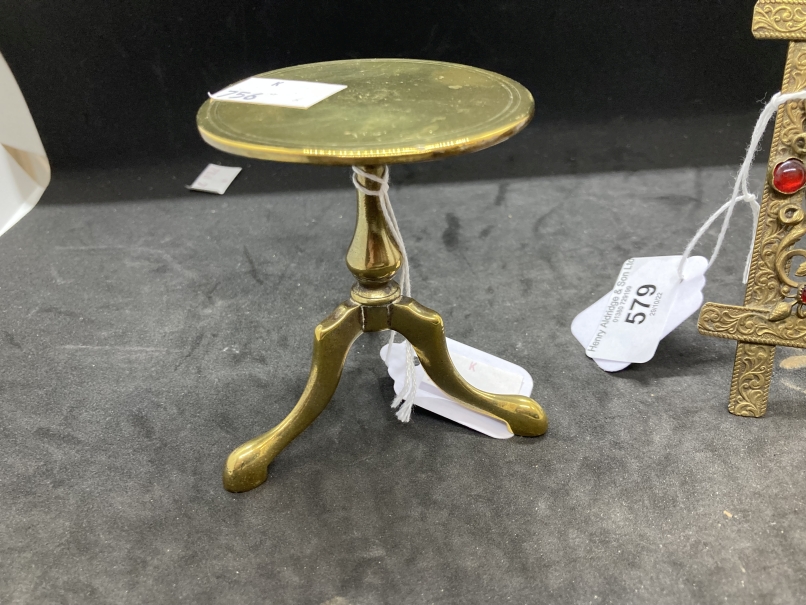 19th cent. Miniature brass tripod table, a brass easel watch holder inset with glass beads and a - Image 4 of 5