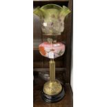 Victorian oil lamp black ceramic base, reeded brass column, pink glass reservoir decorated with