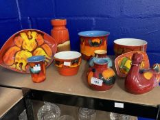 Poole: Collection of mixed orange and red ground ceramics plus a German Scheurich vase. (10)