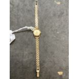 Watches: 9ct yellow gold ladies Rolex Precision wristwatch on a 9ct brick link bracelet.