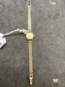 Watches: 9ct yellow gold ladies Rolex Precision wristwatch on a 9ct brick link bracelet.