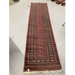Carpets & rugs: 20th cent. North African runner in the style of a Turkman, red ground central