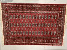 Carpets & Rugs: Late 19th/early 20th cent. Turkman rug, red ground with a central panel containing