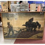 20th cent. Print: A farmer ploughing a field, framed and glazed. 35ins. x 55ins.