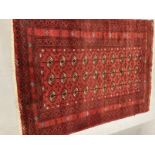 Carpets & Rugs: 19th cent. Turkman rug, red ground with a central panel containing forty guls