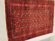 Carpets & Rugs: 19th cent. Turkman rug, red ground with a central panel containing forty guls