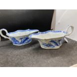 Bow, blue and white sauce boats c1752-55, painted with the residence pattern of small huts and trees