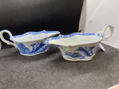 Bow, blue and white sauce boats c1752-55, painted with the residence pattern of small huts and trees