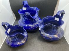 19th cent. Blue ground set of three graduated jugs with gilt lettering to 'Edward Morris Tinman,