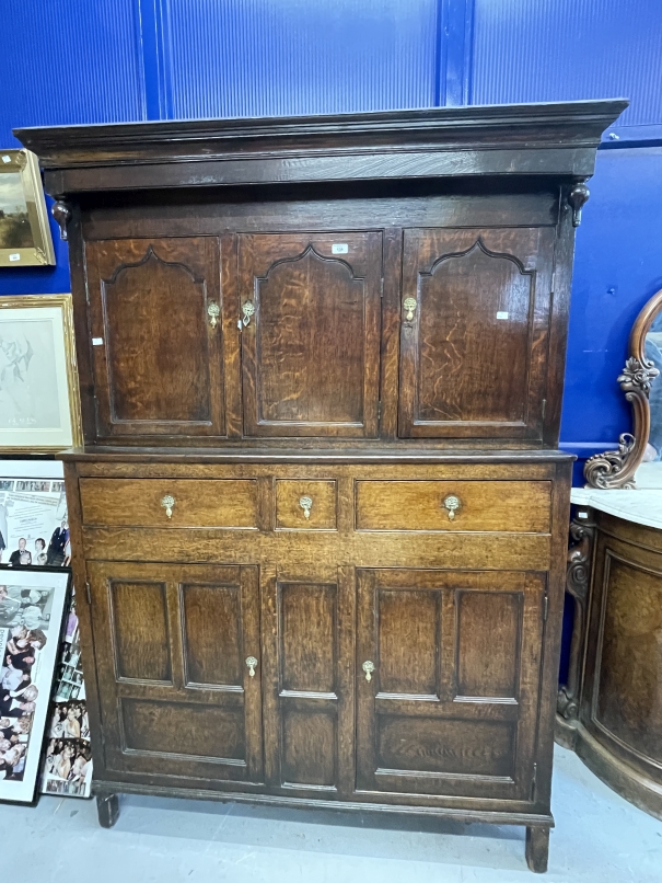 18th cent. Oak court cupboard the top has three panelled cupboard doors, the lower section with