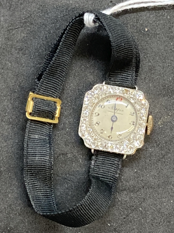 Watches: 18ct gold and platinum ladies diamond set by Mappin attached to a Moira band. Estimated