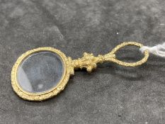 19th cent. Optical Quizing glass, gilt and raised decoration. 2½ins.