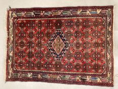 Rugs: Turkish style rug in reds and blues. 56ins. x 40ins.