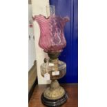 Victorian oil lamp black ceramic base, brass column, clear glass reservoir and pink glass shade,