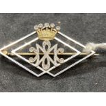 Jewellery: Yellow and white metal brooch open lozenge shape with a five pointed crown above cypher