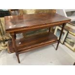 20th cent. Stained pine tea table with carved supports and two leaves.
