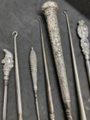Objects of Virtu: Collection of 19th cent. Silver hallmarked and white metal button hooks x 10. Plus