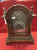 Clocks & Watches: Early 20th cent. German oak cased mantel clock with gilt and white face, applied