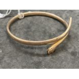 Jewellery: Early 20th cent. Gold bangle in the form of a coiled snake, inner diameter 3ins. Weight