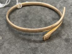 Jewellery: Early 20th cent. Gold bangle in the form of a coiled snake, inner diameter 3ins. Weight