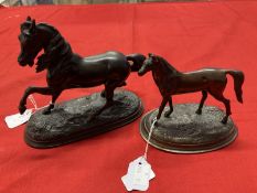 Bronze figure of a prancing horse and a smaller base metal figure of a standing horse.