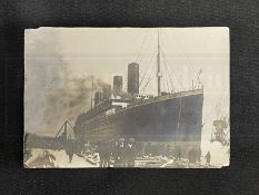 R.M.S. TITANIC: Sepia photograph of Titanic in Belfast, late 1911, the reverse reads "1912", "