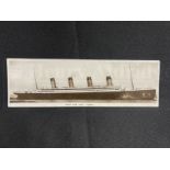 R.M.S. TITANIC: Rare bookpost real photo postcard of Titanic in Belfast written by a Harland and