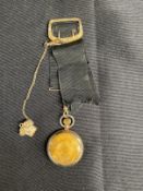R.M.S. TITANIC: Postal clerk Oscar Scott Woody's gilt Ingersoll pocket watch with black ribbon