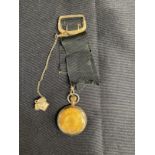 R.M.S. TITANIC: Postal clerk Oscar Scott Woody's gilt Ingersoll pocket watch with black ribbon