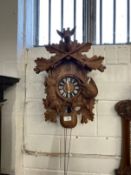 Clocks: 20th cent. Oak Black Forest cuckoo clock. 19ins.