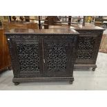 19th cent. Anglo Indian teak cabinets c1860 with carved and pierced cupboard doors and sides