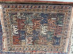 Carpets & Rugs: 19th cent. Kazak rug, multicoloured ground decorated with geometric patterns in