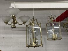 20th cent. Lighting: Two brass six sided lanterns one with bevelled glass panels, the other plain