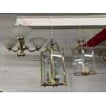 20th cent. Lighting: Two brass six sided lanterns one with bevelled glass panels, the other plain