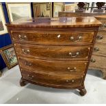 19th cent. Mahogany bow front chest of four long drawers with swan neck brass handles, herring