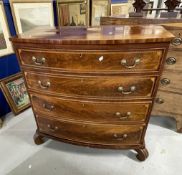 19th cent. Mahogany bow front chest of four long drawers with swan neck brass handles, herring