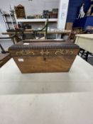 19th cent. Rosewood sarcophagus shaped tea caddy with brass inlay, fitted with two tea compartments,