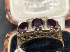 Hallmarked Jewellery: 9ct gold ring set with three oval cut garnets, estimated weight of (3) 3.00ct,