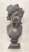 After A. Carrier bronze of a classical woman on a shaped base with ivy in her hair, signed A.