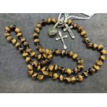 Jewellery: Necklet of (71) 10mm tiger's eye beads, length of necklet 34ins. Plus four pendants,