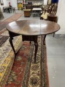 18th cent. Mahogany drop leaf table on cabriole legs and pad feet. Repairs to top and three