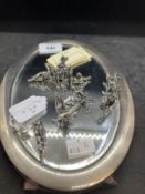 Hallmarked Silver: Oval mirror 9½ins. x 6½ins. Plus eight place name holders in the form of cherubs.