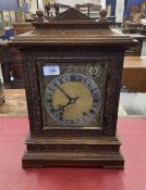 Early 20th cent. Oak cased 8 day bracket clock, brass spandrels and silver Roman numerals dial.