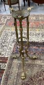 19th cent. Empire style gilt brass jardiniere stand cast leaves and scrolls and three mask heads,