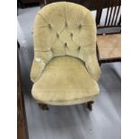 Victorian upholstered button back nursing chair on cabriole front legs. 32ins. Deep x 25ins. Wide.