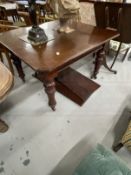 19th cent. Mahogany extending dining table on turned supports with castors, two inserts. Closed