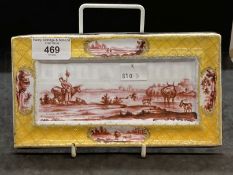 Collectables: 19th cent. Enamel pen rest painted in puce monochrome with cattle in a stream, the